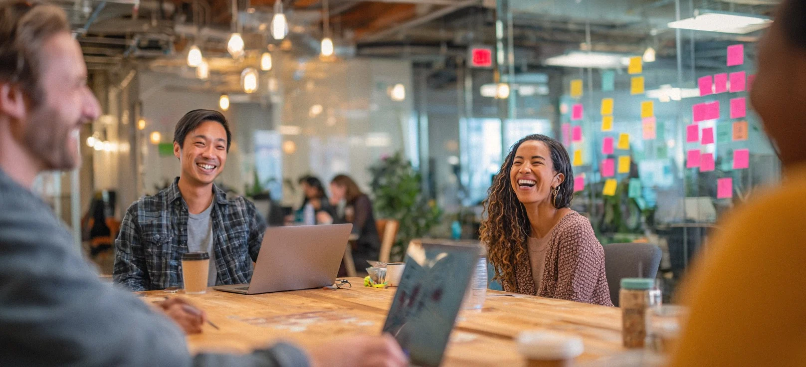 The Visiting From Space tech PR agency team laughing together in a meeting